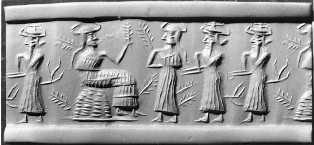 A Photo of a Mesopotamian Cylinder Seal depicting people.